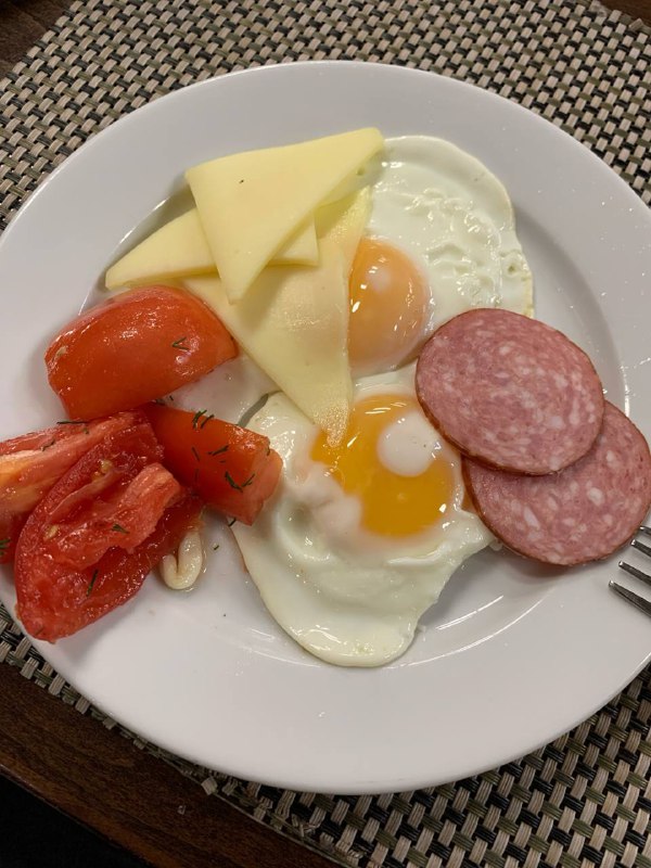 Fried Eggs With Cheese, Salami, And Tomatoes