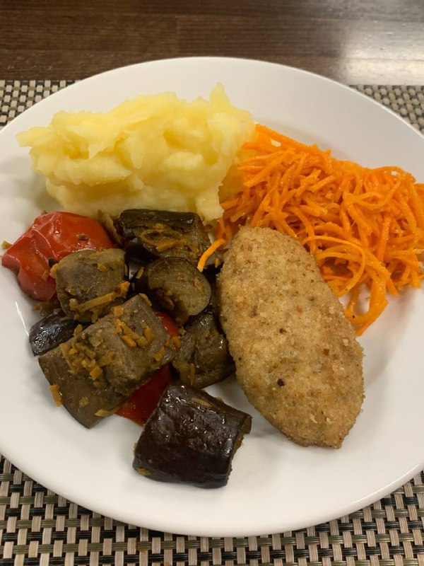 Breaded Cutlet With Mashed Potatoes, Braised Vegetables, And Carrot Salad