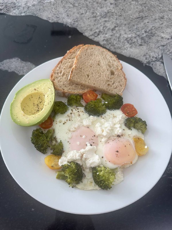 Eggs With Broccoli, Tomatoes, Avocado, And Bread